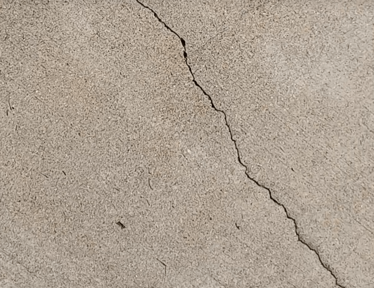 How To Fill In Cracks In Your Concrete - The Daily DIY