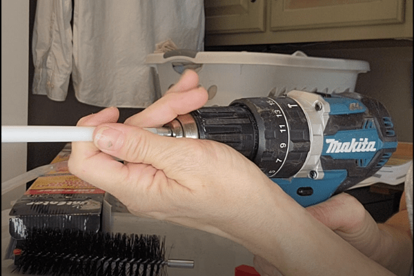 Insert Dryer Vent Cleaning Kit into Drill - The Daily DIY